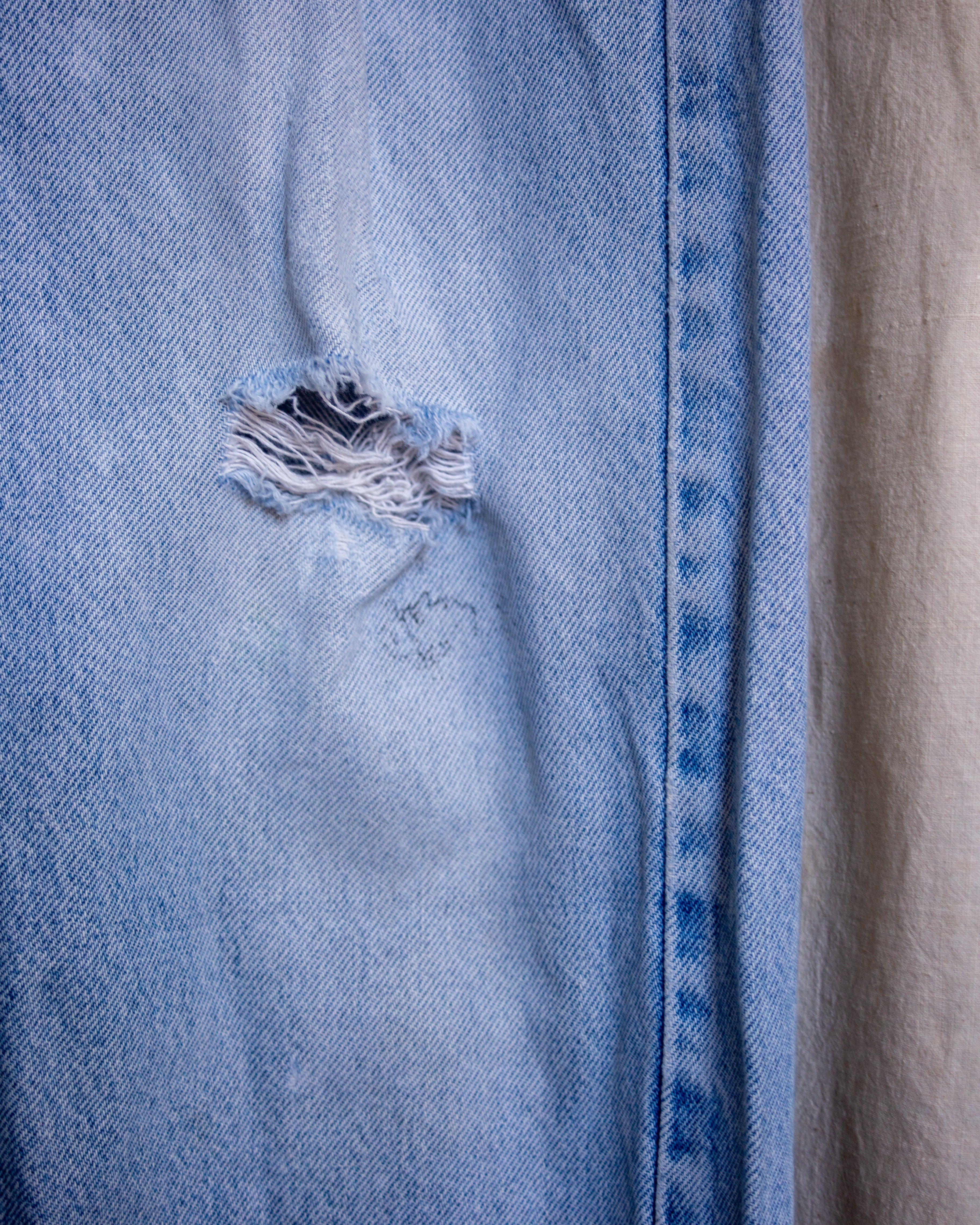 90S Thrashed Repaired Orange Tab Jeans